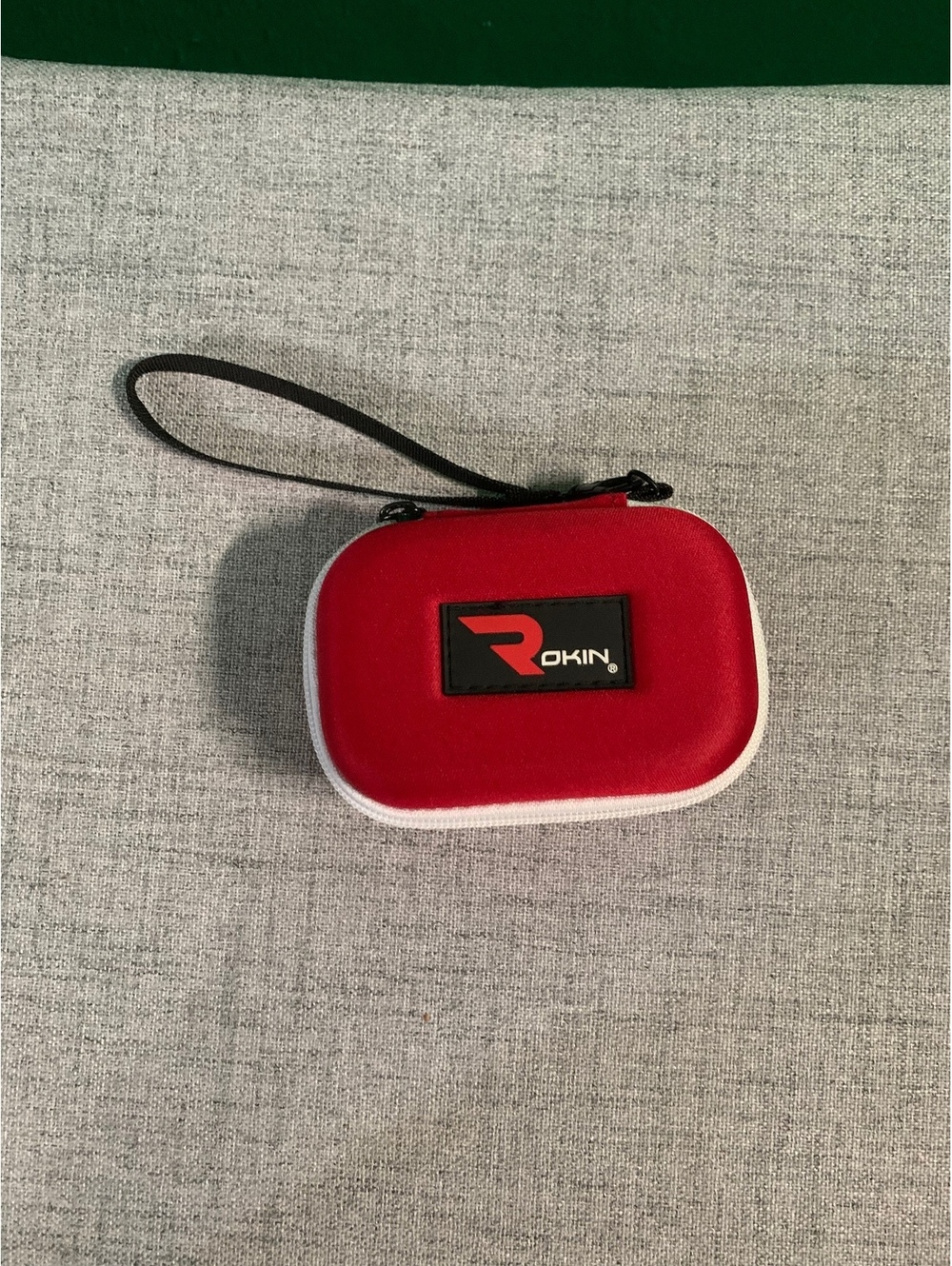 Onn red zip hard case with wrist strap